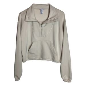 Cream cropped quarter-zip sweater and matching shorts